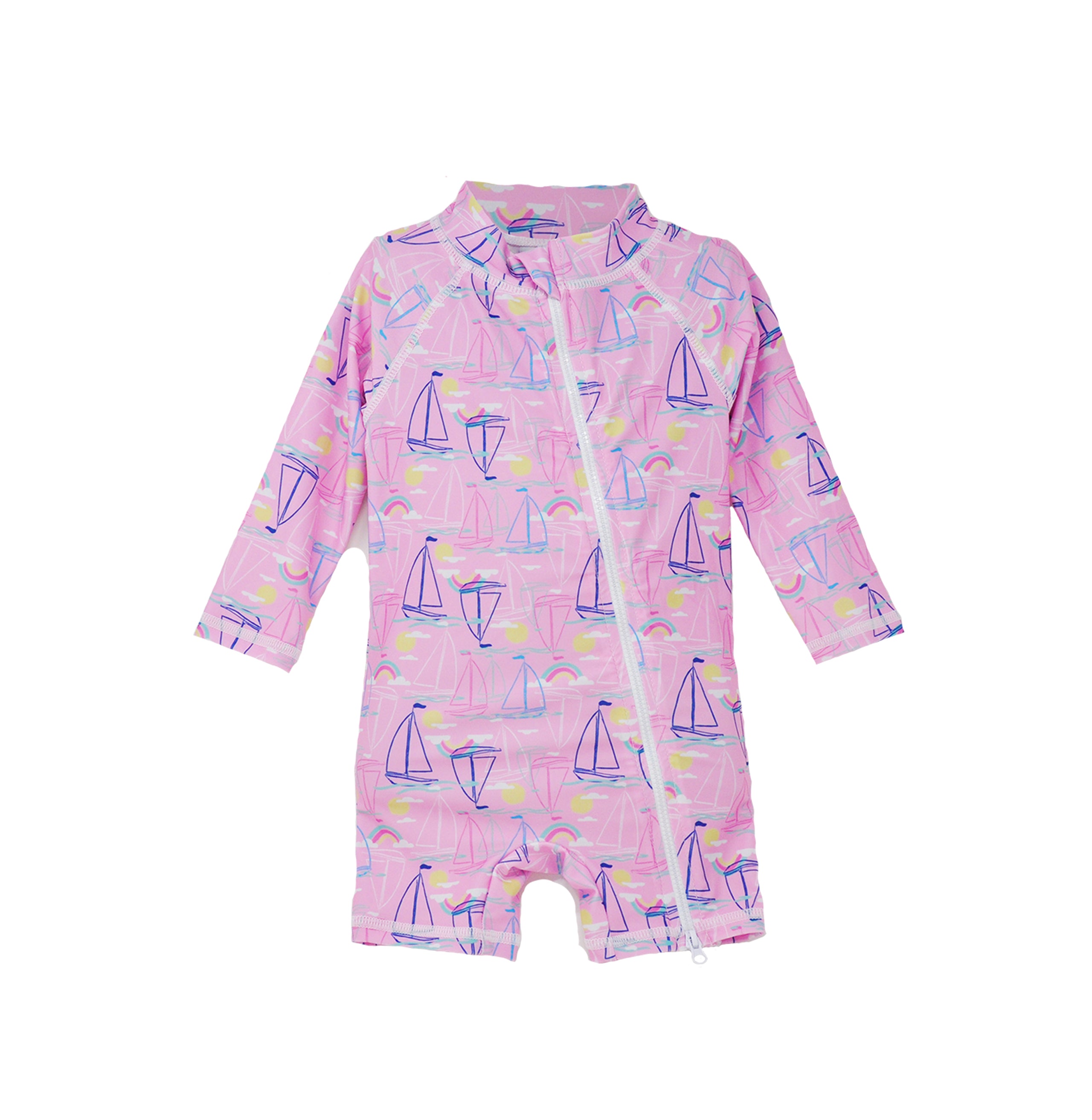 Flap Happy Kids UPF 50+ Shorties Surf Swimsuit in Sail Away for sun protection. The Print is pink with Blue, white and pink sailboats. Surrounded by yellow suns and rainbows.