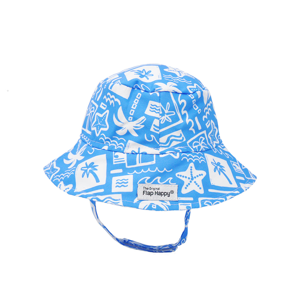  Flap Happy Kids UPF 50+ Bucket Hat Sun Hat in Seaside Palms for sun protection. . The print has white icons of palm trees, water waves and starfish on a blue background.