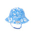  Flap Happy Kids UPF 50+ Bucket Hat Sun Hat in Seaside Palms for sun protection. . The print has white icons of palm trees, water waves and starfish on a blue background.