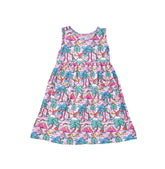 Flap Happy Kids UPF 50+ sleeveless dress with pockets Island Doodles for sun protection. The Print is Pink background with color Palm Trees, sail boats and rainbows.