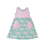 Flap Happy Kids UPF 50+ sleeveless dress with pockets Lotus and Lillies for sun protection. The Print is white background with  green Lotus and Pink Lillies.