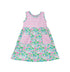 Flap Happy Kids UPF 50+ sleeveless dress with pockets Lotus and Lillies for sun protection. The Print is white background with  green Lotus and Pink Lillies.