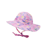 Flap Happy Kids UPF 50+ Floppy Sun Hat in Sail Away for sun protection. The Print is pink with yellow bright suns and a colorful rainbow with blue, white and pink sail boats sailing away. 