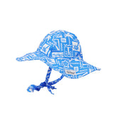 Flap Happy Kids UPF 50+ Floppy Sun Hat in Seaside Palms. The print has white icons of palm trees, water waves and starfish on a blue background. 