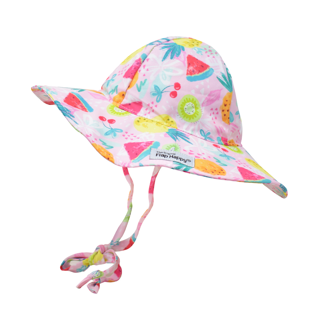 UPF 50+ Floppy Hat - Fruit Fiesta. Light pink hat with  watermelon, pineapple, kiwis, cherries and multicolor floral linework. Ties around neck.