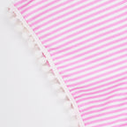 Pink and white striped fabric with a white pom-pom trim along one edge, shown on a plain white background.