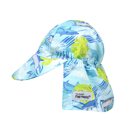 UPF 50+ Original Flap Hat - Undersea Paradise. Light blue hat with grey and blue sharks, bright green palm leaves, and navy and white palm fronds.