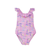 Flap Happy Kids UPF 50+ Crossback swimsuit Sail Away for sun protection. The Print is pink with blue, white and pink sail boats. surrounded by yellow suns and rainbows.