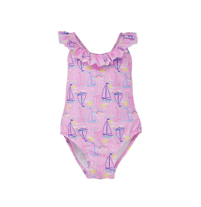 Flap Happy Kids UPF 50+ Crossback swimsuit Sail Away for sun protection. The Print is pink with blue, white and pink sail boats. surrounded by yellow suns and rainbows.