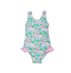 Flap Happy Kids UPF 50+ Infant hip Ruffle swimsuit in Lotus and Lilles for sun protection. The Print has green Lotus and Pink Lillie's.