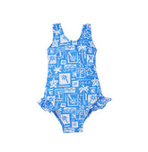 Flap Happy Kids UPF 50+ Infant hip Ruffle swimsuit in Seaside Palms for sun protection. The print has white icons of palm trees, water waves and starfish on a blue background.
