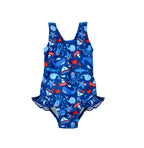 Flap Happy Kids UPF 50+ Infant hip Ruffle swimsuit in Nautical Fun for sun protection. The Print is Navy with red sail boats. surrounded by whales, Octopus, and pirate starfishes.
