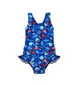 Flap Happy Kids UPF 50+ Infant hip Ruffle swimsuit in Nautical Fun for sun protection. The Print is Navy with red sail boats. surrounded by whales, Octopus, and pirate starfishes.
