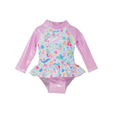  Flap Happy Infants UPF 50+ Ruffle Rash Guard swimsuit in Mermaid Friends. The print has fishes, whales and turtles. with water waves and flowers on a white background.
