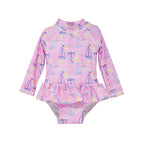  Flap Happy Infants UPF 50+ Ruffle Rash Guard swimsuit in Sail Away. The print has Blue and Pink colored  sail boats. With bright yellow sun and  small colorful rainbows.  