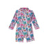 Flap Happy Kids UPF 50+ Shorties Surf Swimsuit in Island Doodles for sun protection. The Print is pink with colorful sailboats and palm trees.