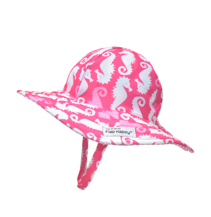 UPF 50+ Summer Splash Swim Hat - Happy Pink Seahorses. Hot pink hat with light pink and white seahorses. Velcro chin strap.