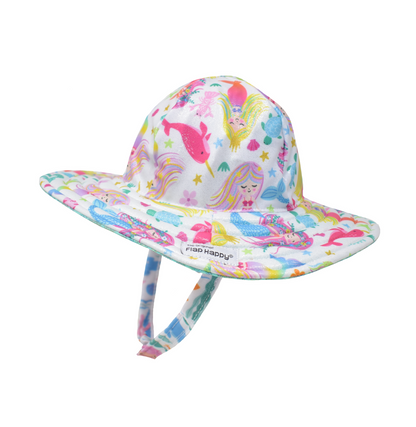 UPF 50+ Summer Splash Swim Hat - Sparkly white hat with multicolored mermaids, pink narwhales, jellyfish, turtles, starfish and shells. Sparkly turquoise mermaid scale fabric on underside of brim. Velcro chin strap.