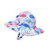 UPF 50+ Summer Splash Swim Hat - Rosy Whales. White hat with light and dark pink, and light and dark blue watercolor whales. Velcro chin strap.