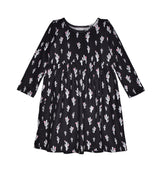 White cactus with pink flowers on a black background